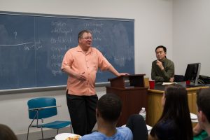 man speaking to class