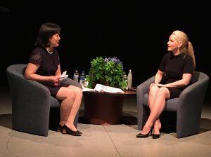 women sitting and speaking