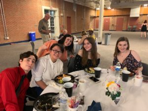 group posing at table