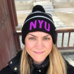 girl wearing NYU beanie