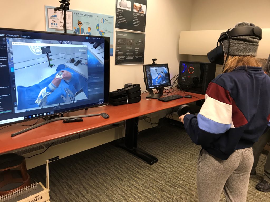 person in virtual reality with screen in front