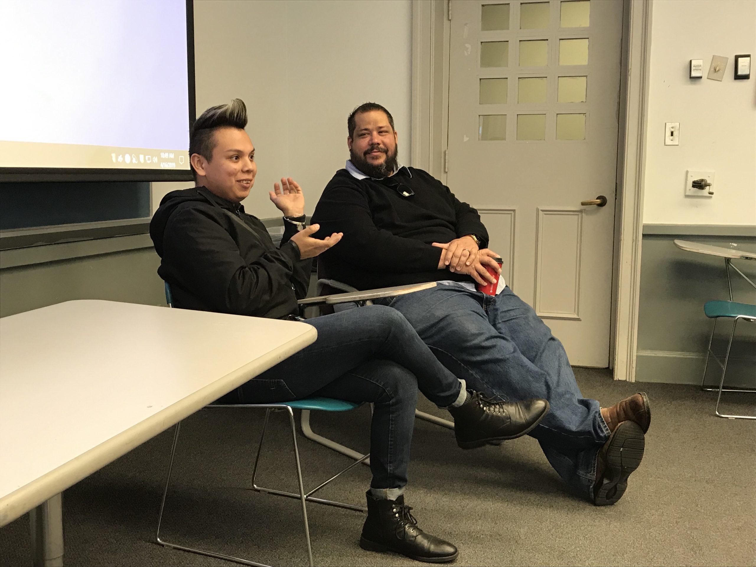 two people speaking to class