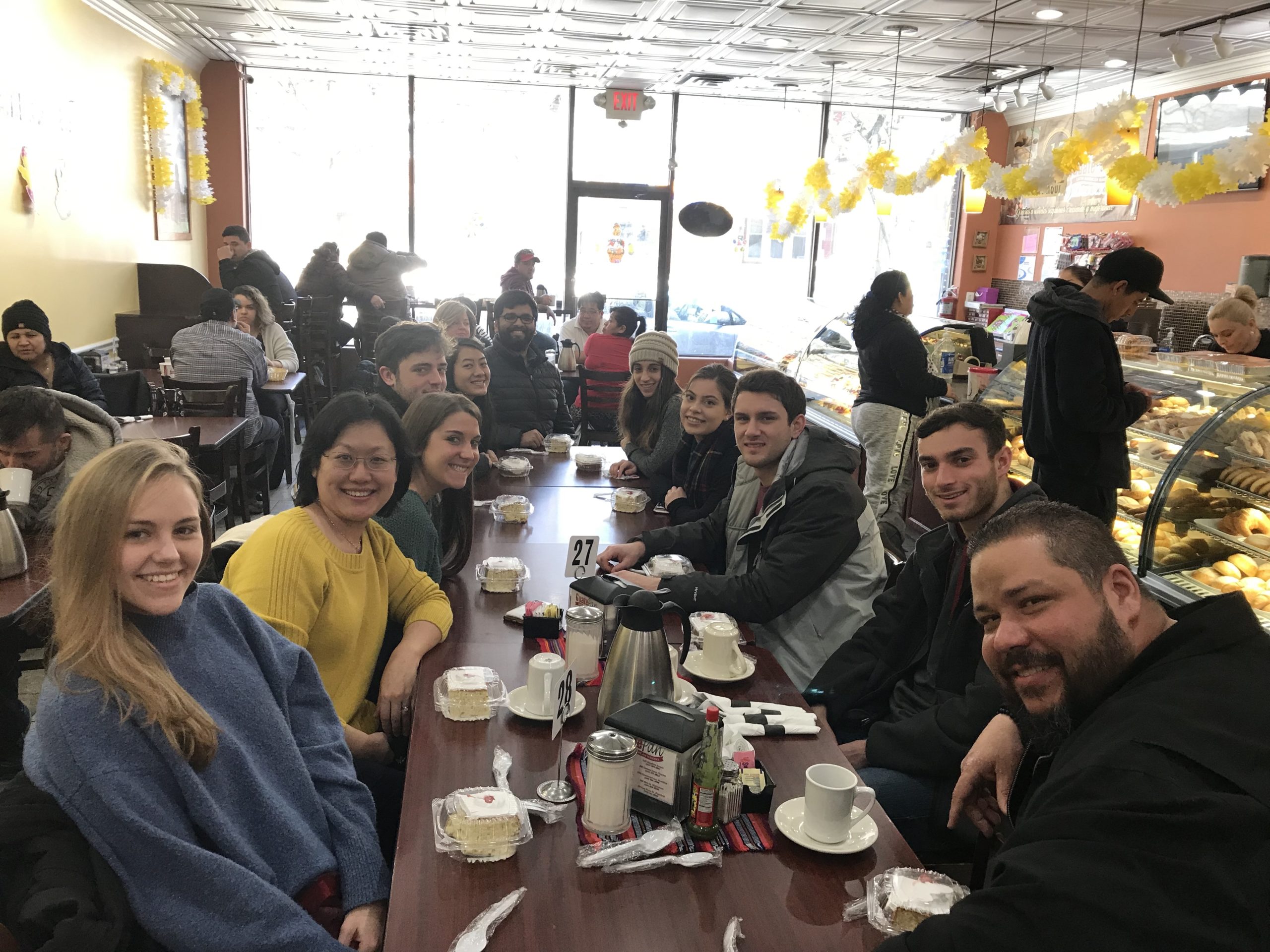 group posing at restaurant table